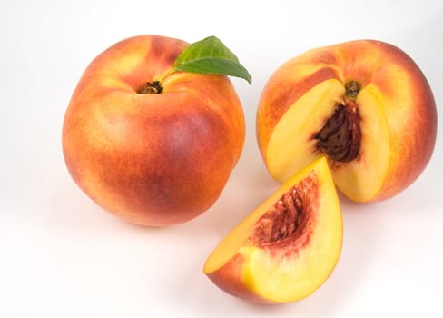 Ripe nectarines on white background