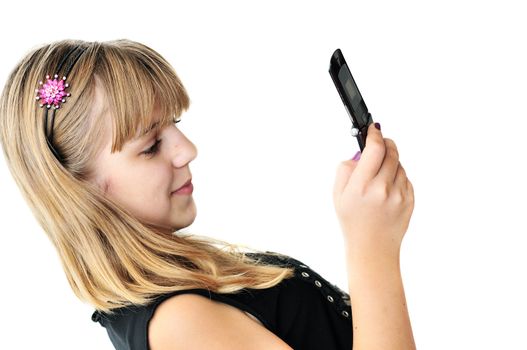teenage girl typing sms on the mobile phone over the white