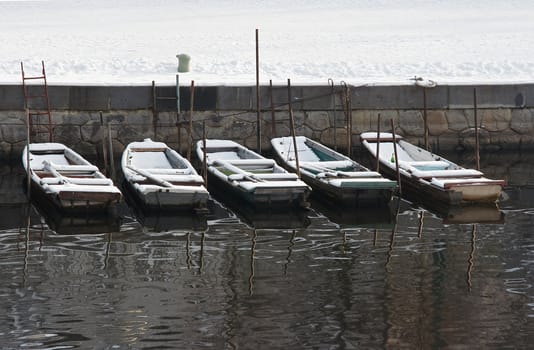 Shot of the snowy fishing-boats