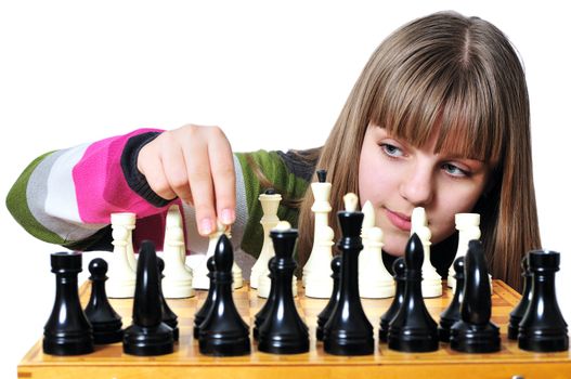 Young teen girl starting  set of chessmen - e2-e4
