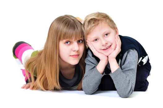 happy brother and sister in studio over the white