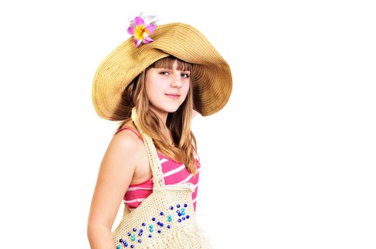 teen girl wearing srtaw hat going to the beach