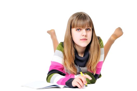 writing laying sweet teen girl over the white