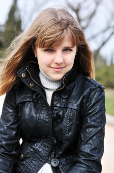 portrait of teen girl wearing leather jacket