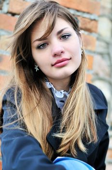 prtrait of teen girl near the brick wall