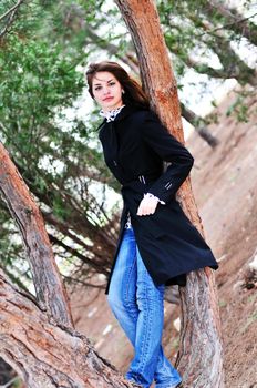   portrait of lovely teen girl near the tree

