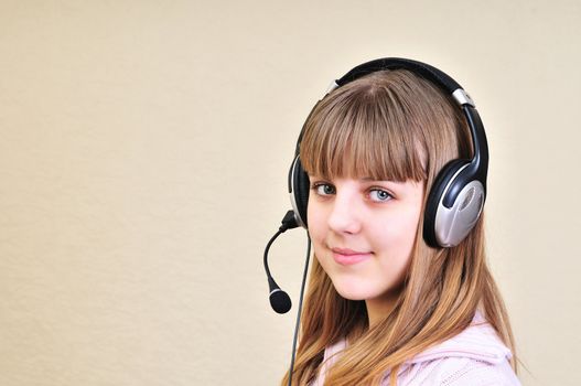 teenage girl in headphones chatting with friend

