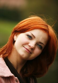 Portrait of the girl with red hair