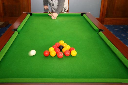 senior male cueing  off at a game of pool