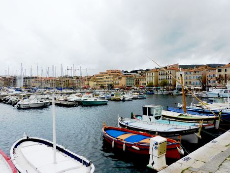 Port of La Ciotat, France, with boats and buildings by cloudy weather