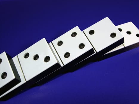 Dominoes on a dark blue background