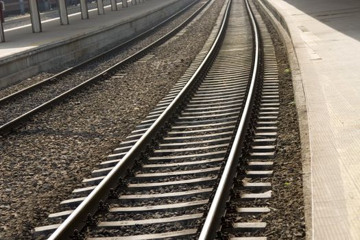 old railway in train station, perspective view 