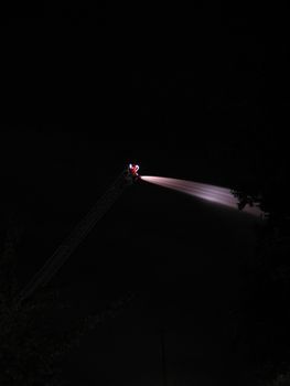 firefighter hose in the night