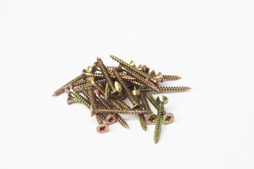 Pile of wood screws isolated on white background