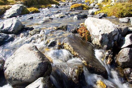 Rapid mountain brook in National Park Aiguestortes - Spain. Sunny day.