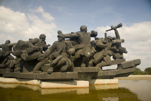 Soldiers rushing to battle in a Soviet era WW2 memorial in Kiev Ukraine