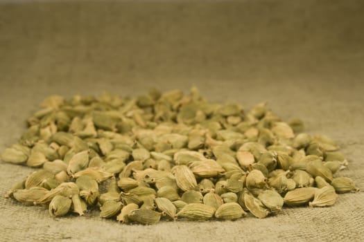 Cardamom fruits on burlap