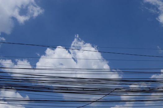 internet city cables on sky and clouds background
