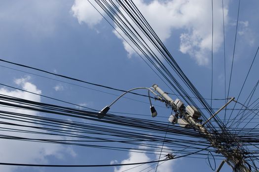 internet city cables on sky and clouds background