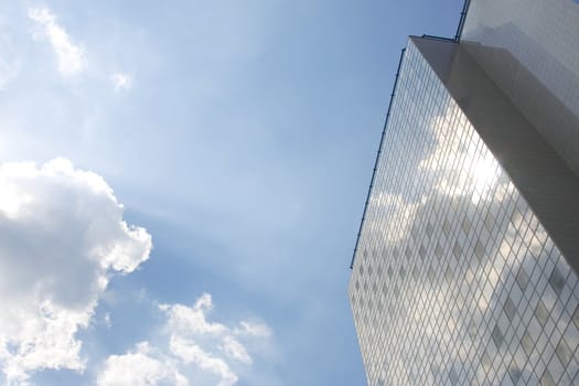 perspectiv view of office building with blue sky reflection