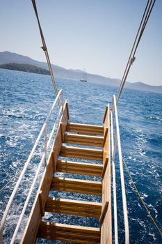 Boat ladder and the sea