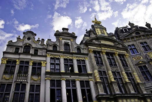 The ornate guild houses that line the Grand Place of Brussels, Belguim are decorated with gold. 