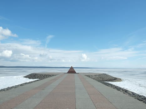 Granite pyramid on coast of lake (Petrozavodsk, Russia)   