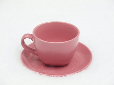 Violet cup on a snow        