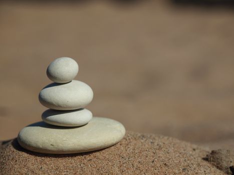 White pebble on sand on coast of lake      