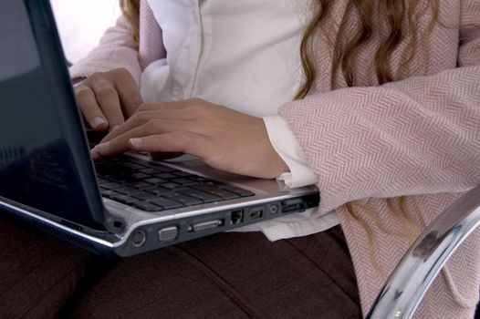 female working on laptop with white background