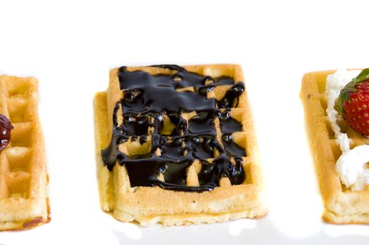 waffles on white background, focus on chocolate waffle