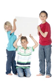 three boys with a sign