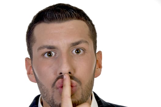 man instructing to be silent with white background