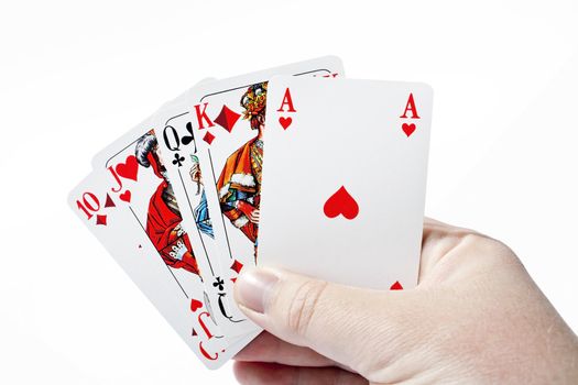 Right hand holding cards - straight in poker game