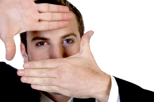 young businessman making a finger frame in front of his eyes with white background