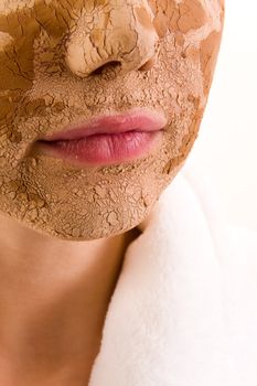 Portrait of young woman with facial mask