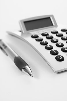 Pen and calculator (business background)