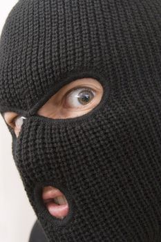 evil criminal wearing military mask