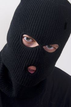 evil criminal wearing military mask