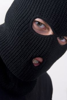 evil criminal wearing military mask
