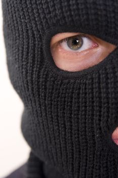evil criminal wearing military mask