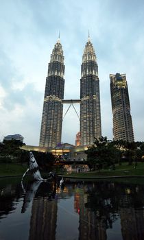 The view of PETRONAS Twin Towers from the KLCC park at dusk