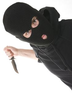 evil criminal wearing balaclava with a knife