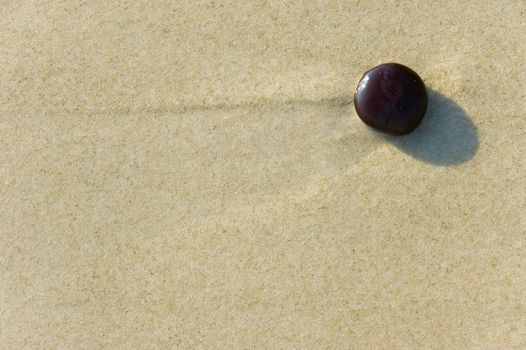 round stone on a beach