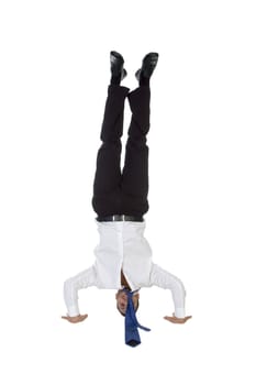 man doing topsy turvy against white background