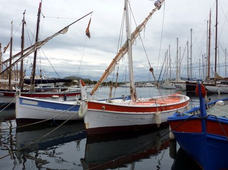 Many boats at the port of Sanary-sur-mer, France, by cloudy weather