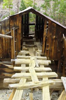 Ruins of historic old gold mine building in the mountains of Colorado