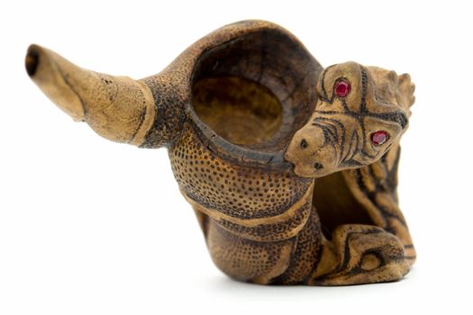 Dragon. Wood engraving. Tobacco pipe close up.