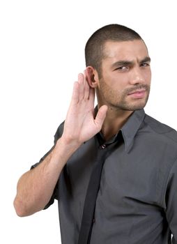 young man hard of hearing holds hand up to ear to listen