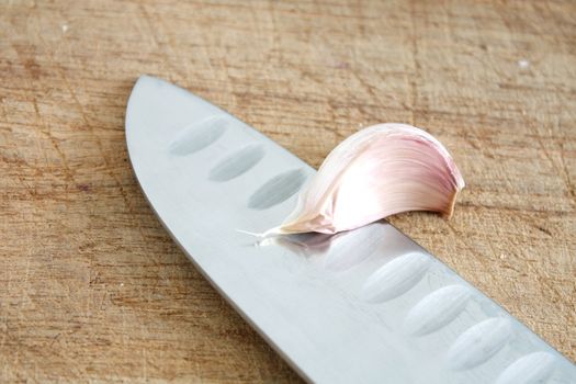 Fresh garlic on a wooden background